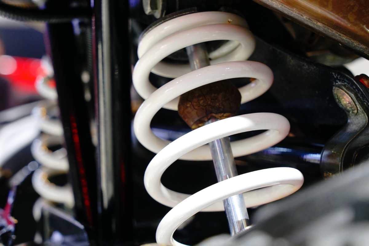 Linear rate coil spring used in car suspension for consistent compression and stable ride