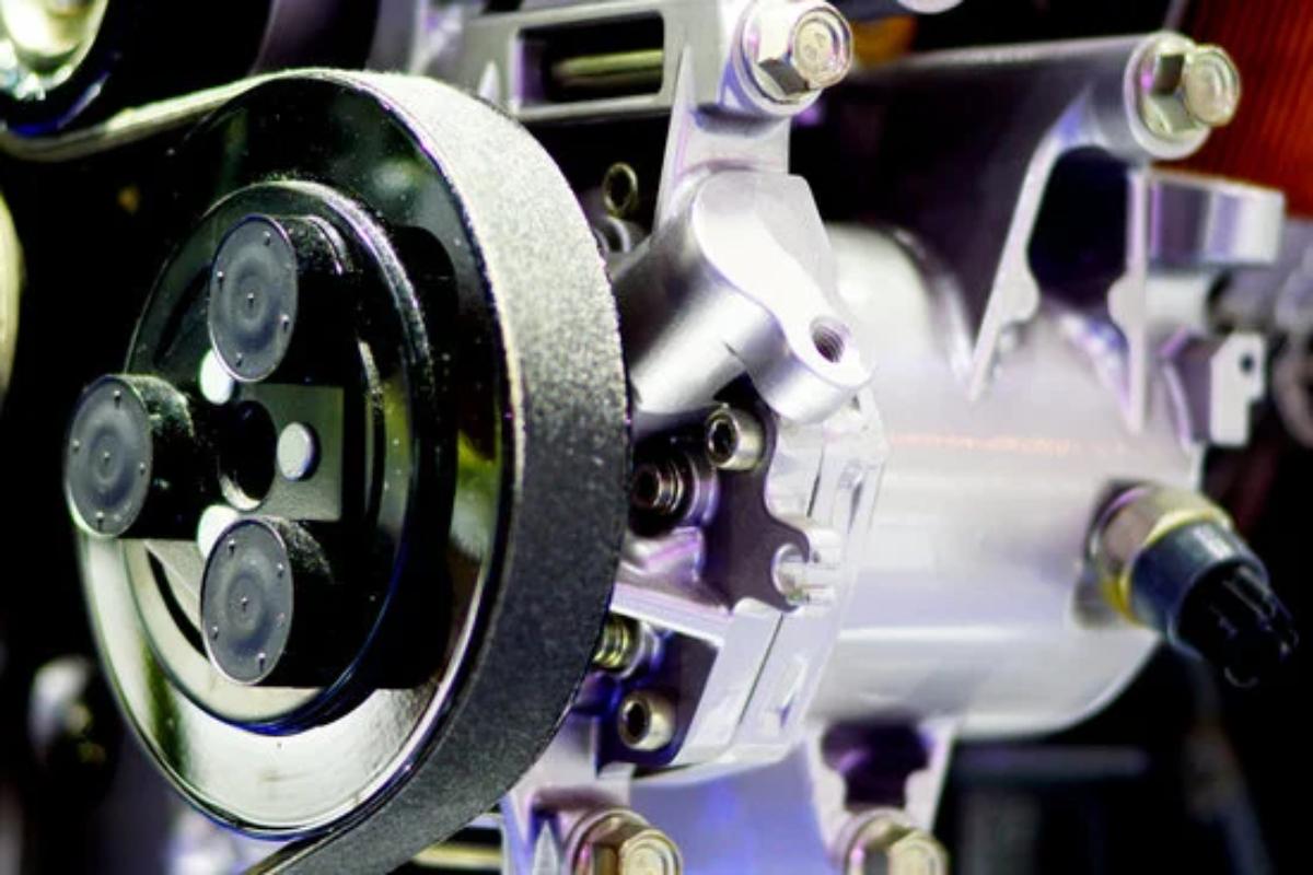 Car with power steering pump problems showing steering wheel resistance and fluid leak – power steering pump issues explained.