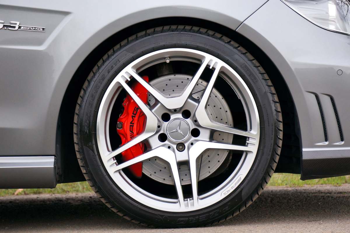 Car tires showing signs of misalignment and imbalance, leading to uneven tread wear and vibration while driving.