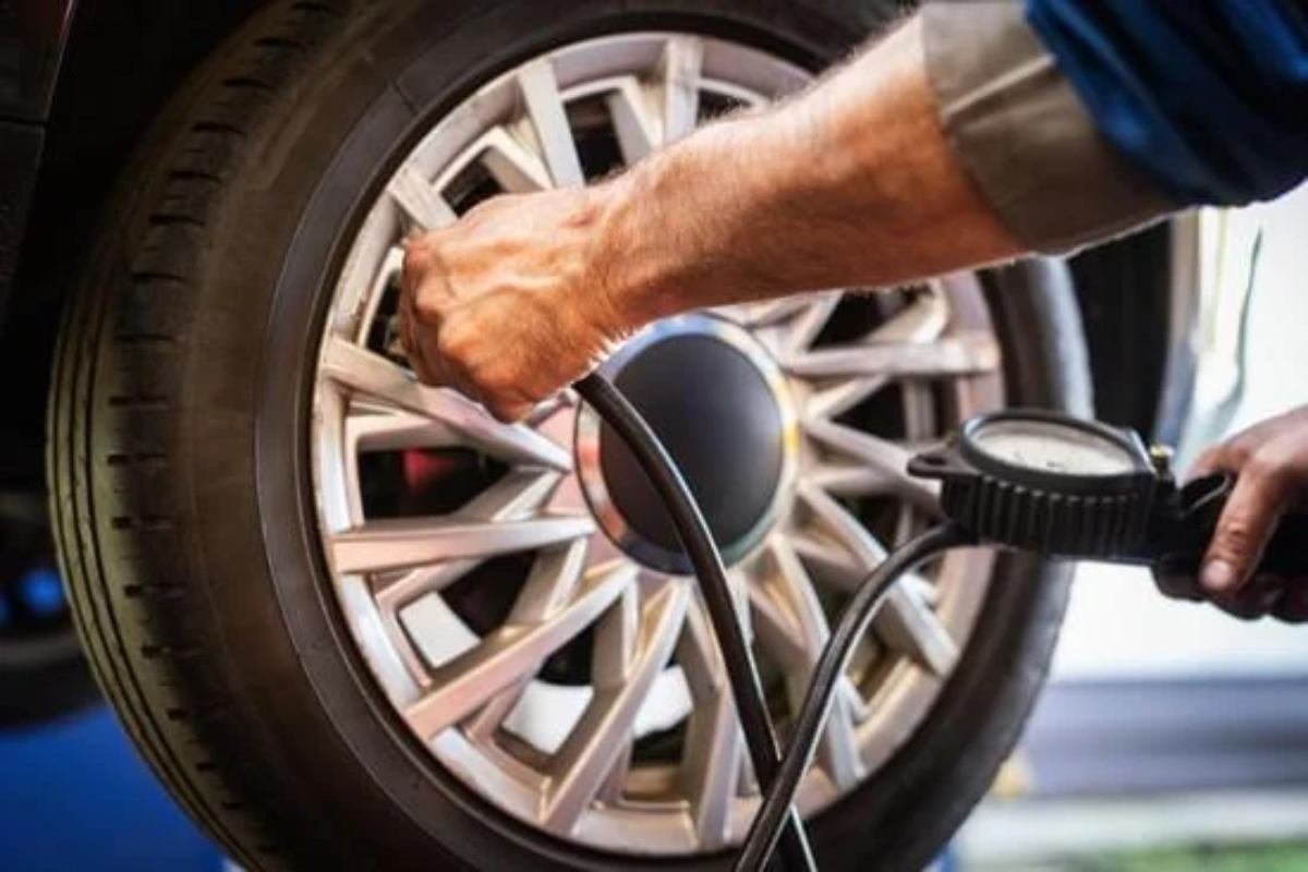 Car tire with low pressure warning or underinflated/overinflated tire.