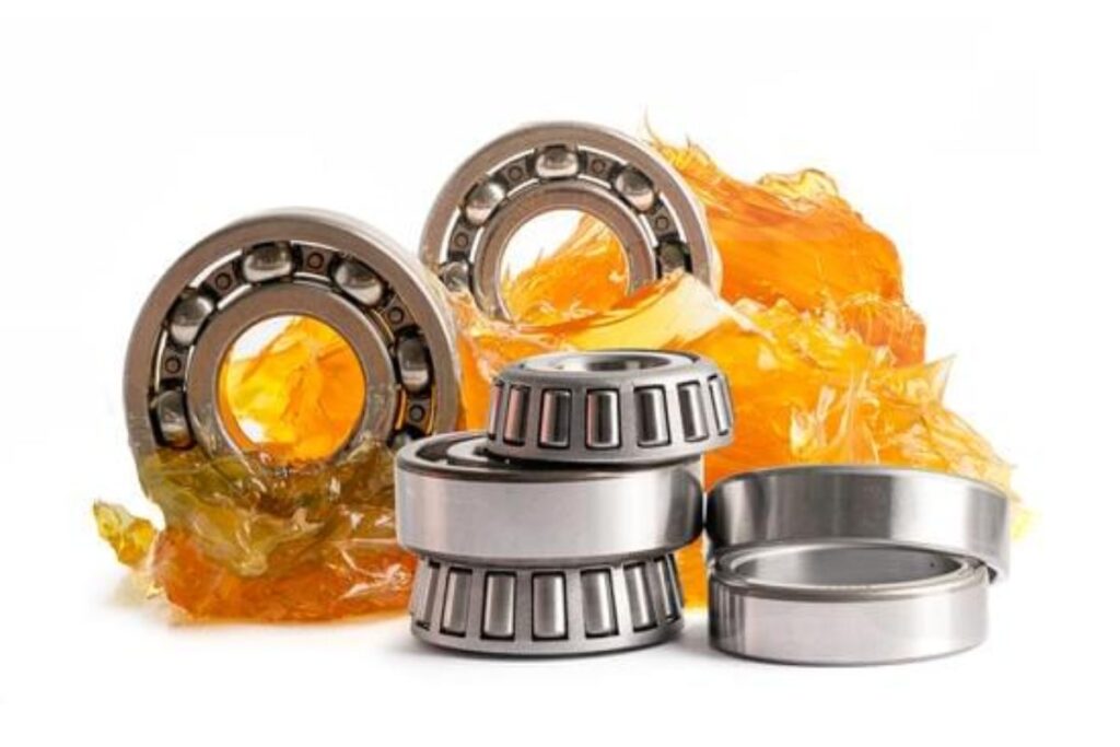 Close-up of a car wheel showing bearings and tire contact points.