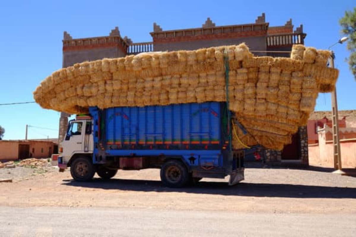 Overloaded car with heavy cargo causing suspension strain and reduced ride comfort