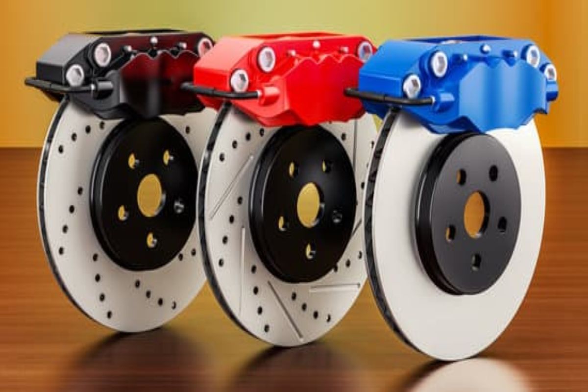 What causes brake pedal vibration Close-up of a warped brake disc showing uneven surface and rust spots.