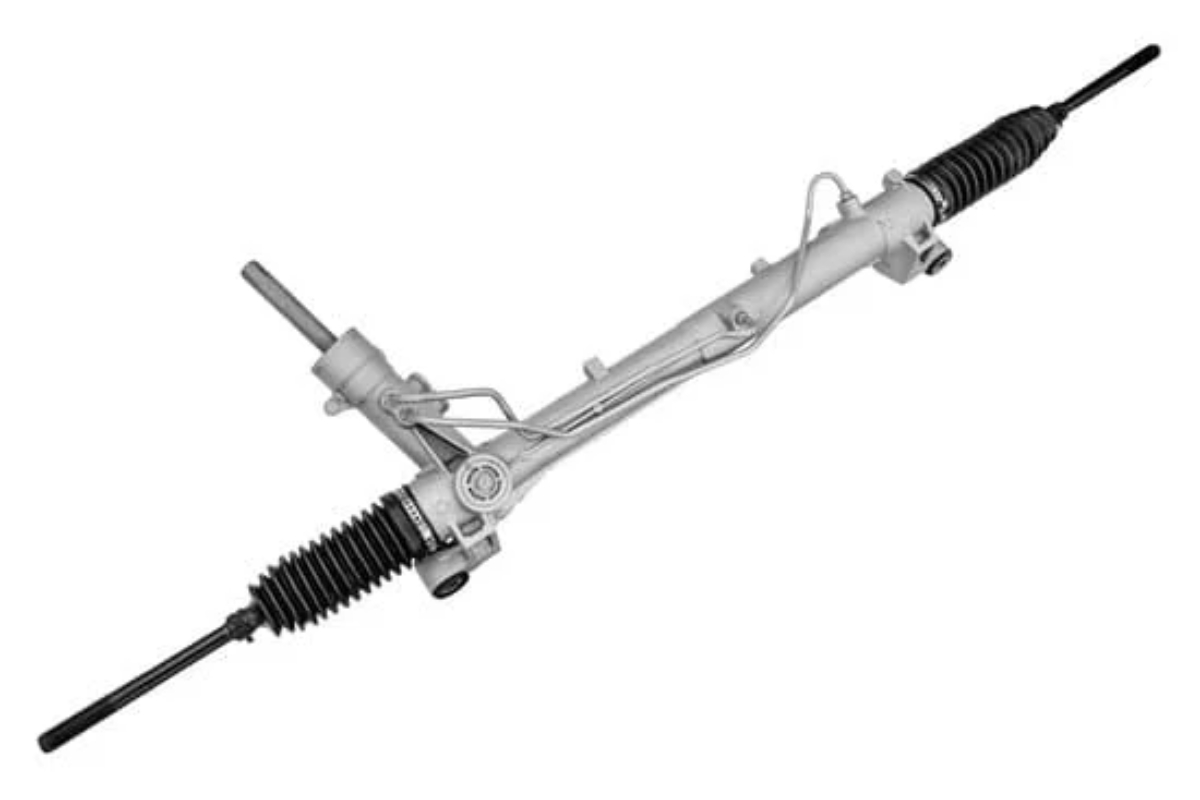 Close-up of a worn steering rack and pinion assembly in a car.